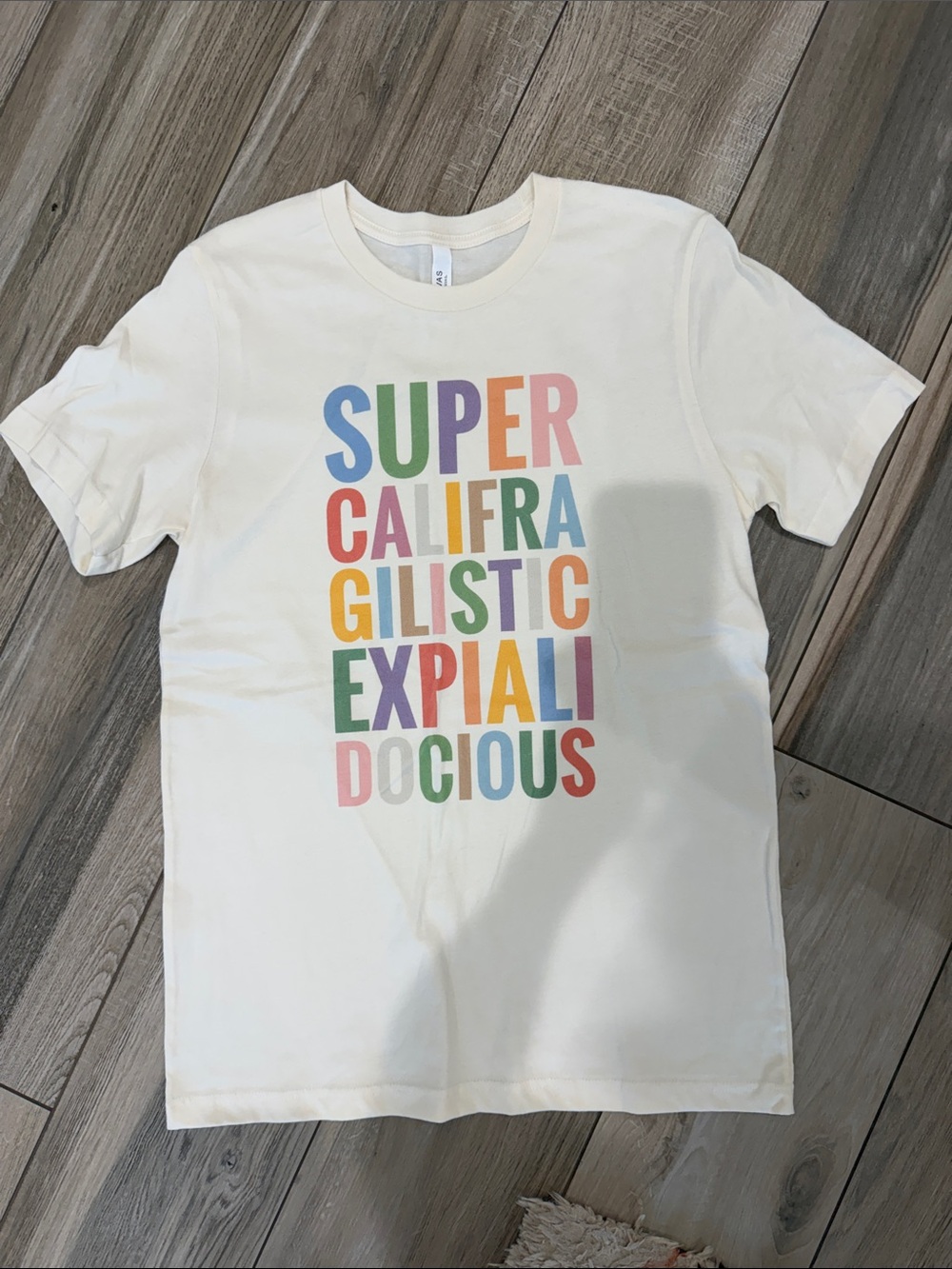 Bella Canvas Cream Short Sleeve Tee with Multicolor Block Letter Graphic
